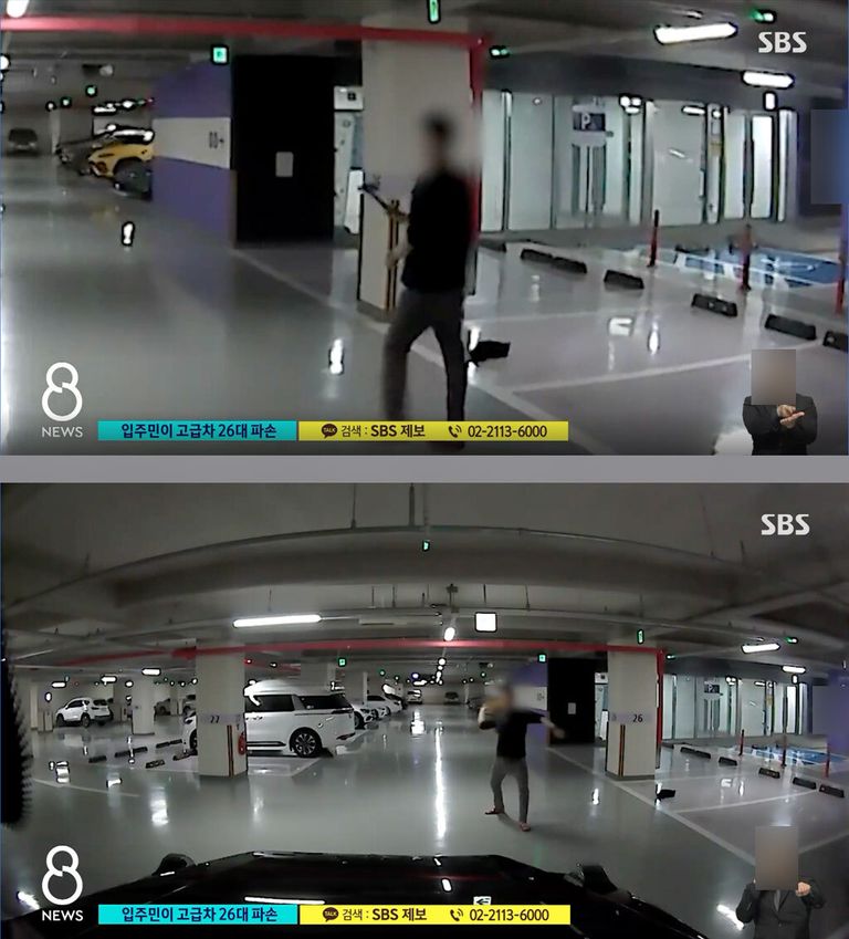 자신의 아파트 주차장에서 둔기를 들고 다니며 범행을 저지르는 모습이 피해 차량 블랙박스에 고스란히 담겼다. /SBS뉴스 캡처